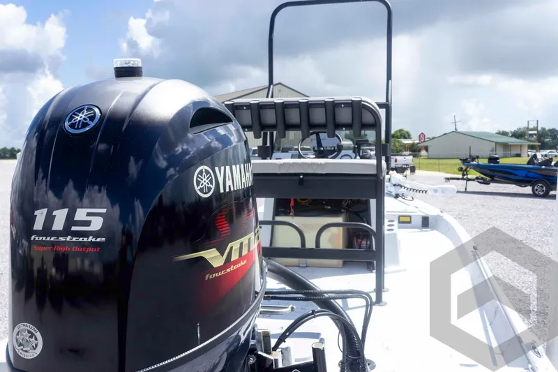 Slide: The Image of 2017 Shoalwater 19' Catamaran with Yamaha 115 four-stroke engine in a sunny outdoor setting. - 11