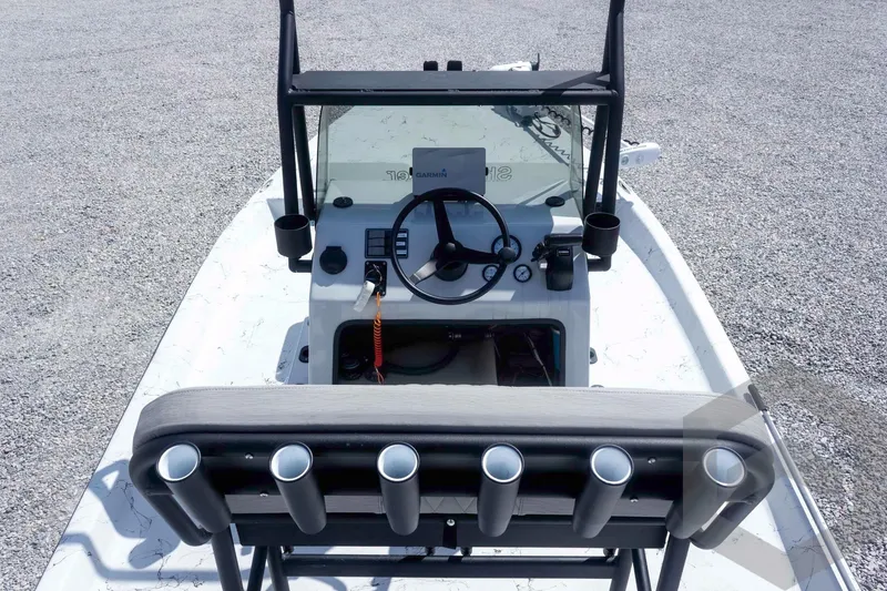 Slide: The Image of 2017 Shoalwater 19' Catamaran boat interior with steering console and rod holders. - 17