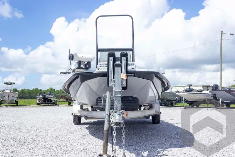 Slide: The Image of 2017 Shoalwater 19' Catamaran on trailer, parked outdoors under a cloudy sky. - 3