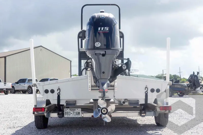 Slide: The Image of Rear view of a 2017 Shoalwater 19' Catamaran with Yamaha 115 outboard motor. - 7