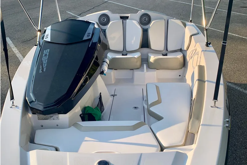 Slide: The Image of 2015 Scarab 165 ID boat interior with seating and storage compartments. - 12