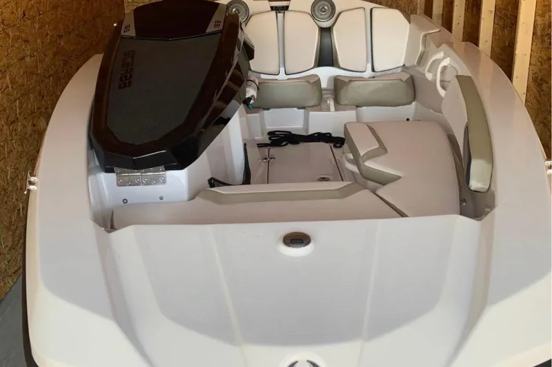 Slide: The Image of 2015 Scarab 165 ID boat interior with seating and storage compartments. - 13