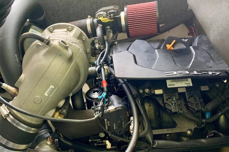 Slide: The Image of Engine of a 2015 Scarab 165 ID boat, featuring a Rotax turbocharger. - 18
