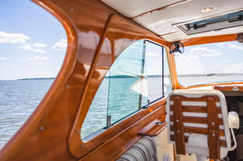 Slide: The Image of Interior view of 2013 Hinckley Talaria 34 yacht with wooden finish and ocean backdrop. - 15