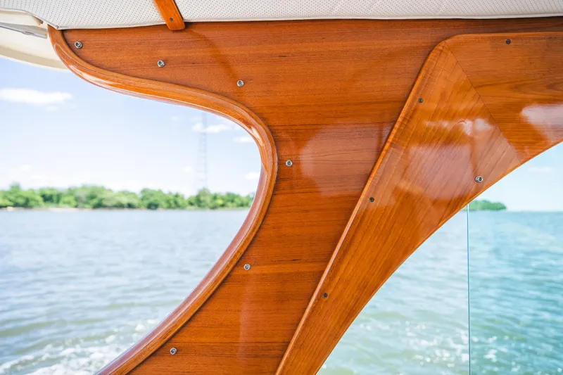 Slide: The Image of Polished wooden interior detail of 2013 Hinckley Talaria 34 boat with scenic water view. - 19