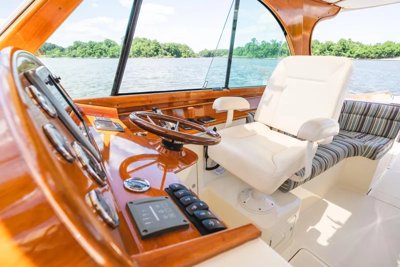 Slide: The Image of Interior of 2013 Hinckley Talaria 34 yacht with luxurious helm and seating. - 26