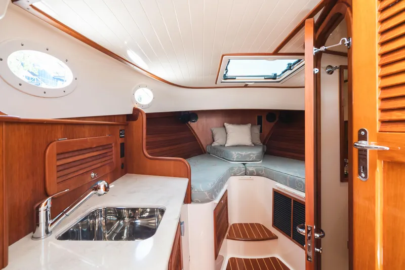Slide: The Image of Luxurious interior of 2013 Hinckley Talaria 34 yacht with cozy cabin and kitchenette. - 30