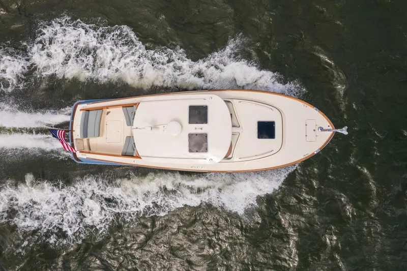 Slide: The Image of Aerial view of 2013 Hinckley Talaria 34 yacht cruising on water. - 6