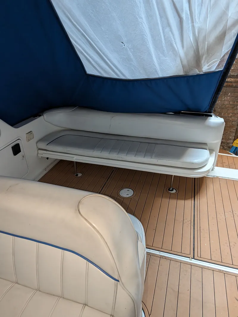 Slide: The Image of Interior of a 1995 Sea Ray Sundancer 330 with blue and white seating. - 5