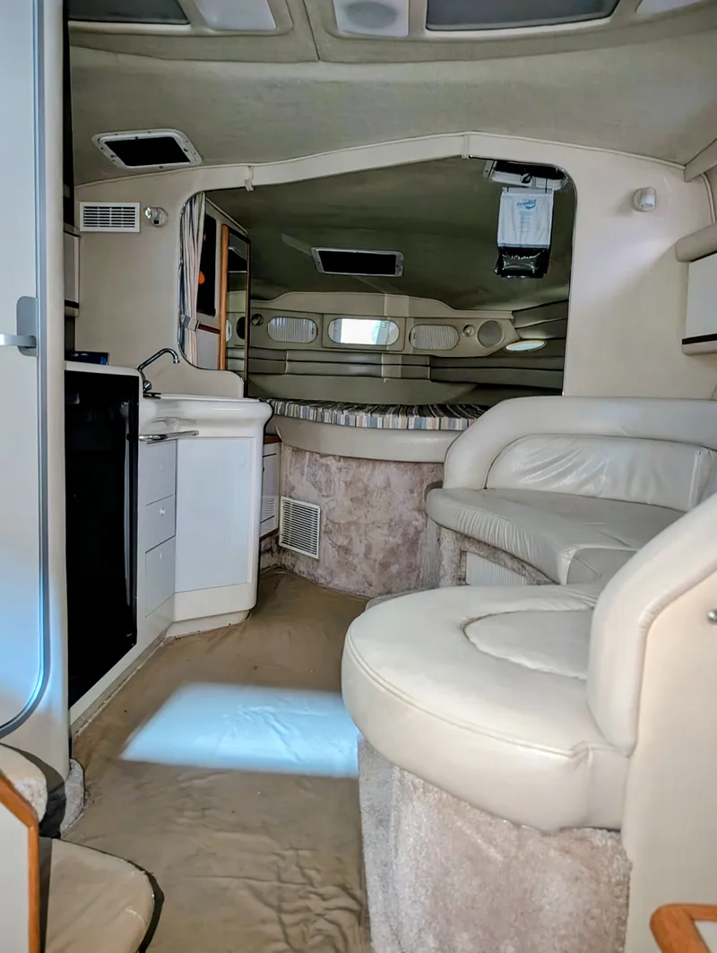 Slide: The Image of Interior of a 1995 Sea Ray Sundancer 330 yacht with seating area. - 7