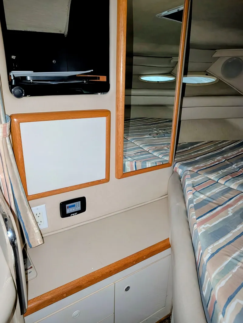 Slide: The Image of Interior of a 1995 Sea Ray Sundancer 330 with mirror and bed. - 8