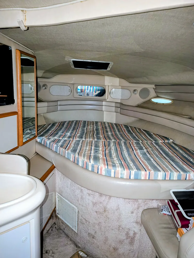 Slide: The Image of 1995 Sea Ray Sundancer 330 yacht interior with sleeping area. - 9