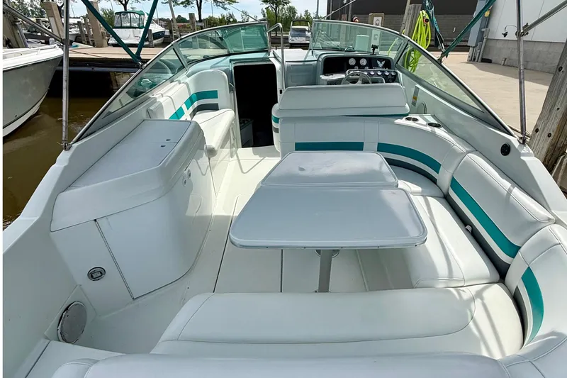 Slide: The Image of 1995 Formula 280 Sun Sport boat interior with white seating and table. - 13