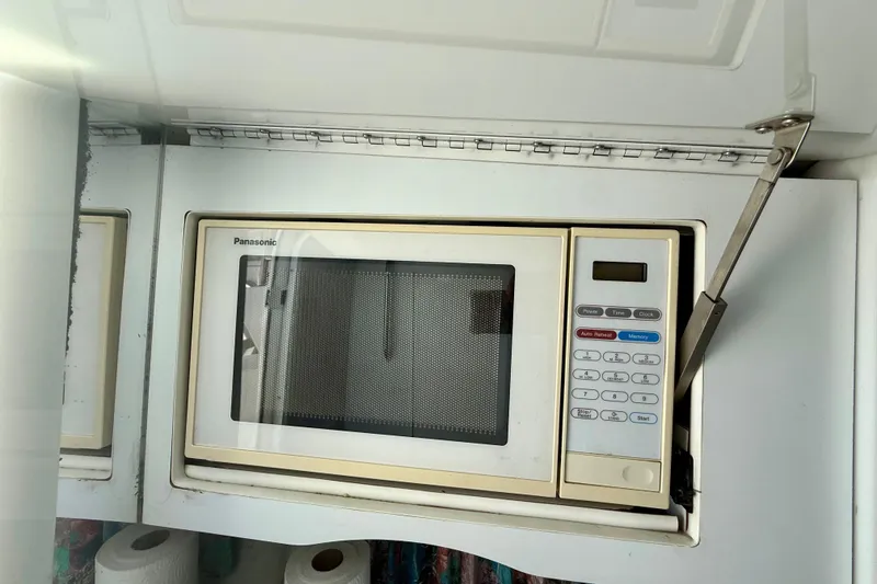 Slide: The Image of Built-in Panasonic microwave in a 1995 Formula 280 Sun Sport boat kitchen. - 21