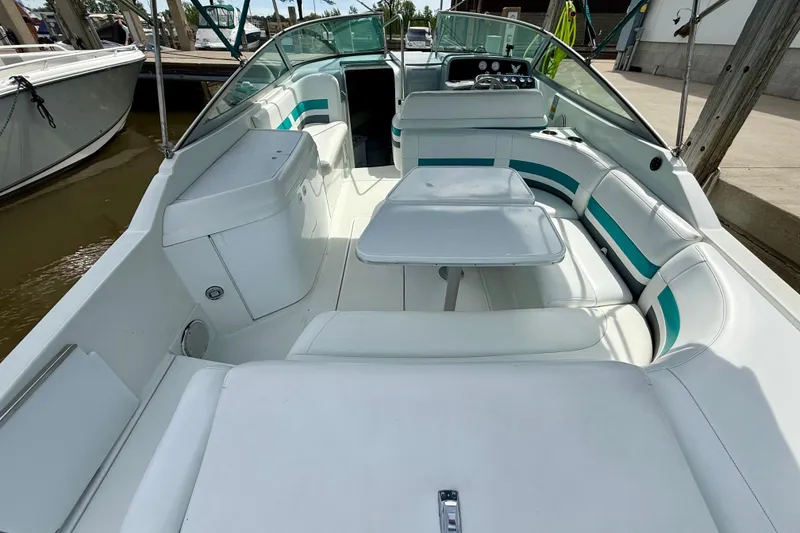 Slide: The Image of 1995 Formula 280 Sun Sport boat interior with white seating and table. - 7