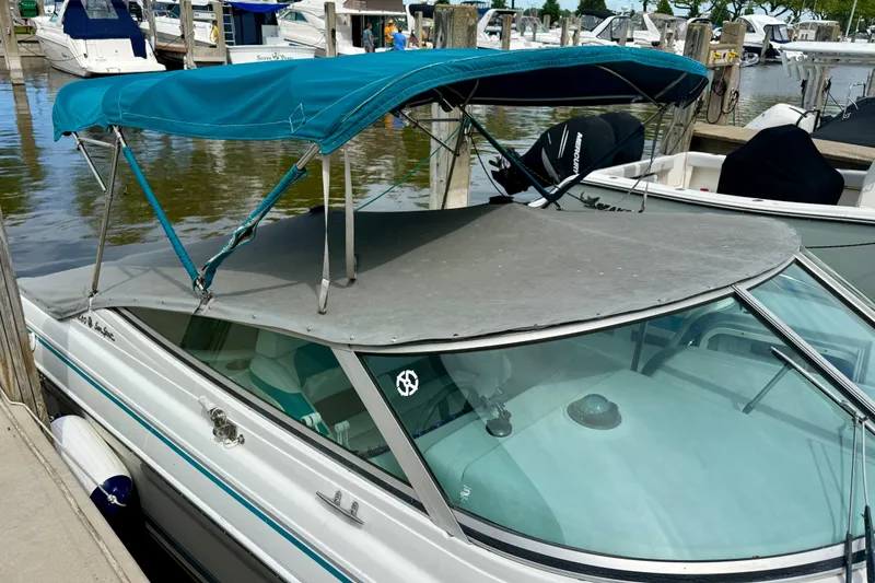 Slide: The Image of 1995 Formula 280 Sun Sport boat docked with blue canopy and windshield cover. - 9