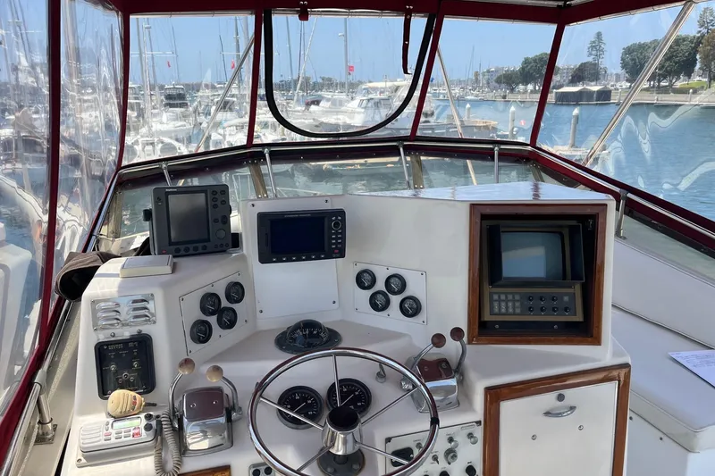 Slide: The Image of Interior seating of 1980 Golden Egg 48 Sport Fish boat with white cushions. - 11
