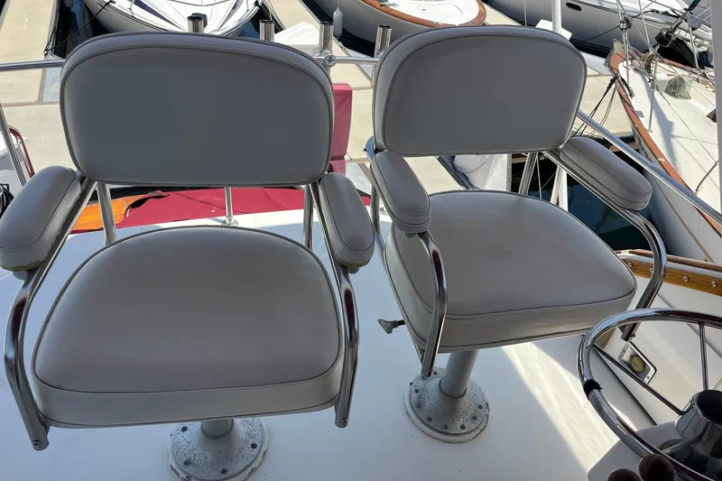 Slide: The Image of Two covered seats on a 1980 Golden Egg 48 Sport Fish boat. - 14