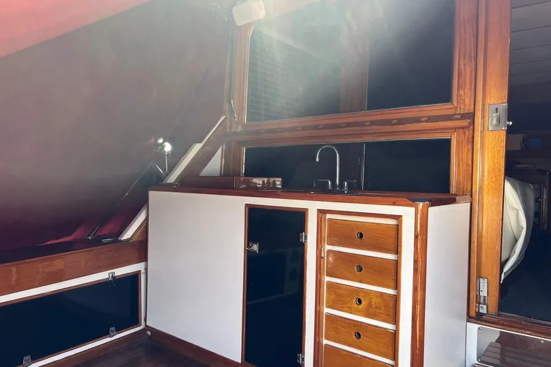 Slide: The Image of Wooden ladder inside 1980 Golden Egg 48 Sport Fish boat, leading to upper deck. - 16