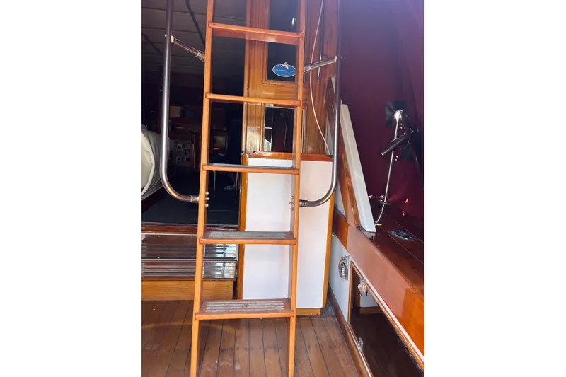 Slide: The Image of 1980 Egg Harbor 52 Convertible yacht with wooden deck and seating area. - 17
