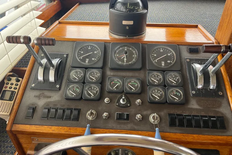 Slide: The Image of Electrical control panel inside a 1980 Egg Harbor 52 Convertible boat. - 22