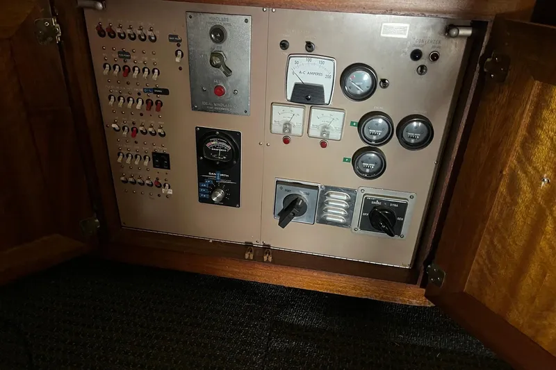 Slide: The Image of Interior of 1980 Egg Harbor 52 Convertible yacht with wooden helm and modern electronics. - 23