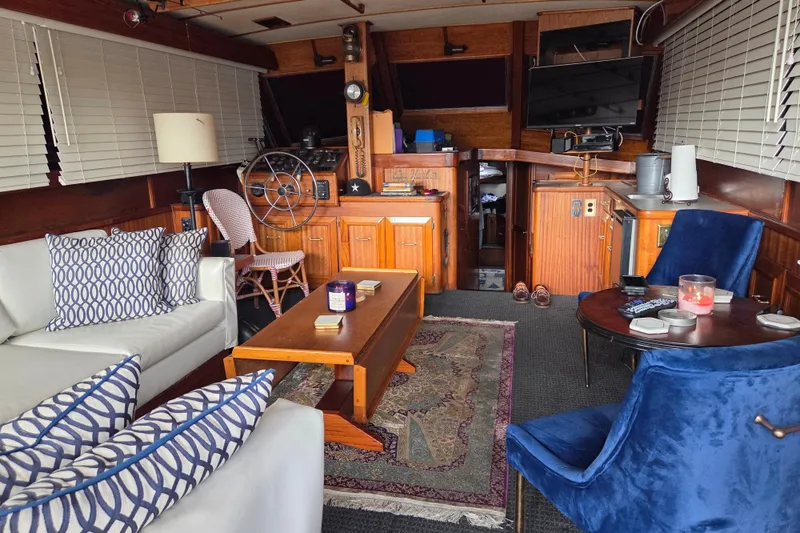 Slide: The Image of Interior of 1980 Egg Harbor 52 Convertible yacht with kitchenette, sink, and mounted TV. - 25