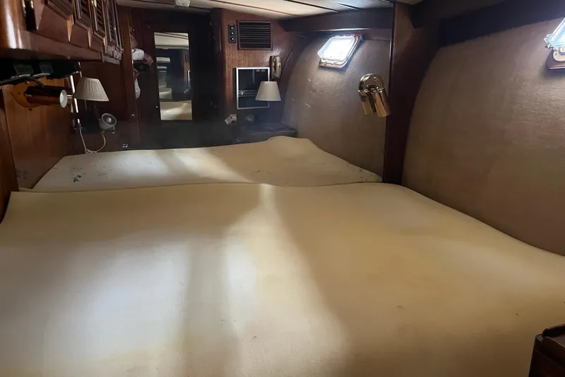Slide: The Image of Interior of 1980 Egg Harbor 52 Convertible with wooden cabinets and lamp. - 29