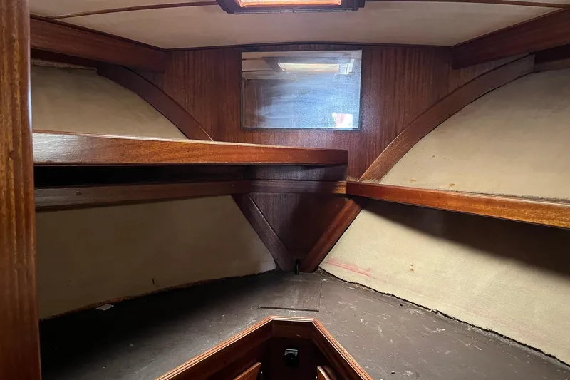 Slide: The Image of Interior of 1980 Egg Harbor 52 Convertible yacht with wooden cabinetry and shelving. - 31