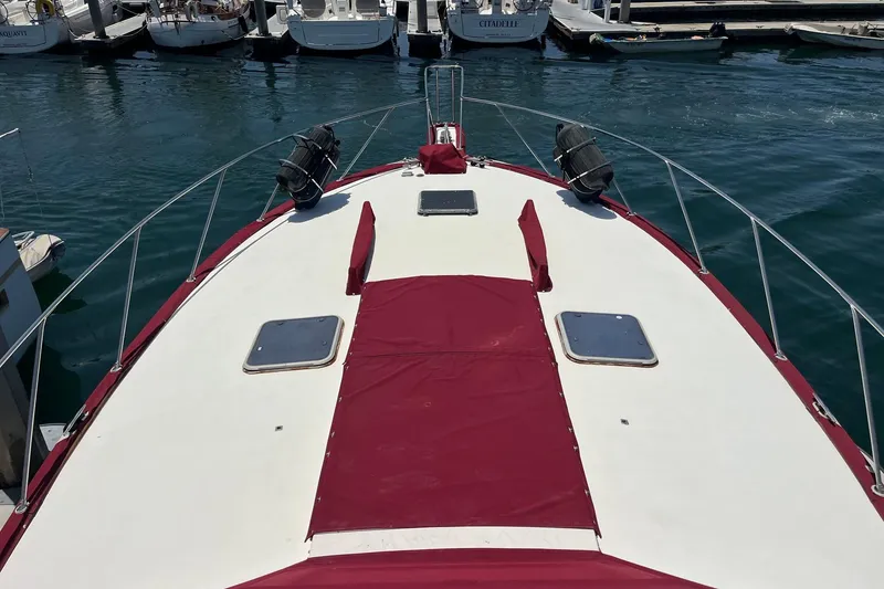 Slide: The Image of Red canopy of 1980 Golden Egg 48 Sport Fish boat at marina. - 7