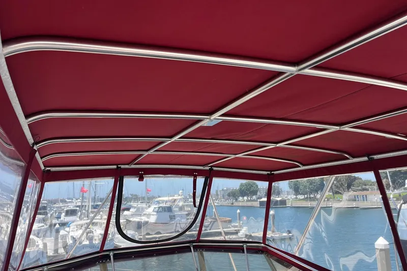 Slide: The Image of Interior view of 1980 Golden Egg 48 Sport Fish boat with red canopy. - 8