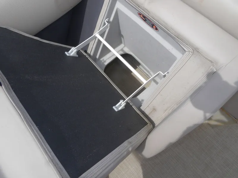 Slide: The Image of 2024 Harris Pontoon seat with storage compartment. - 18