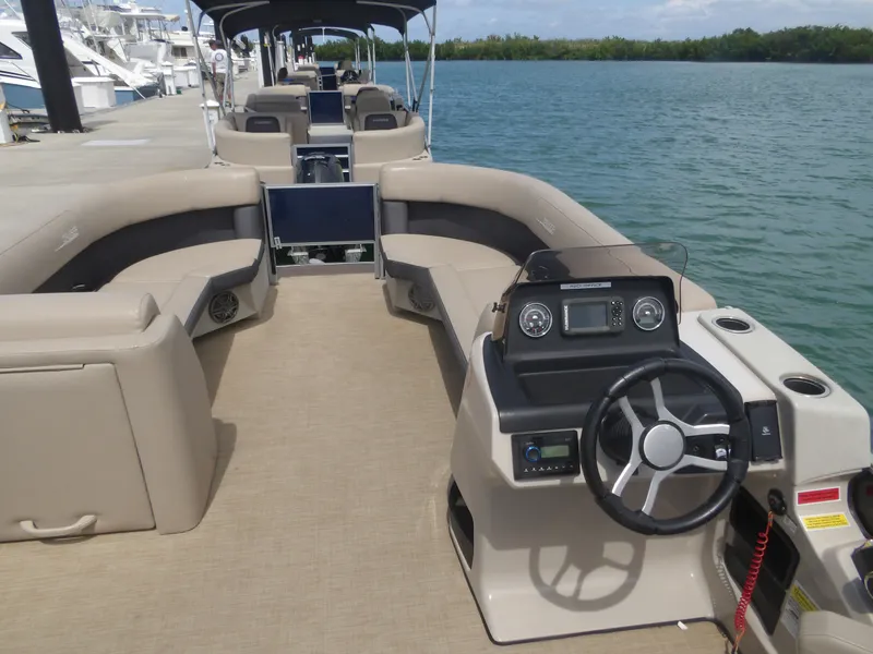 Slide: The Image of 2024 Harris Pontoon boat with luxurious interior and helm console. - 20