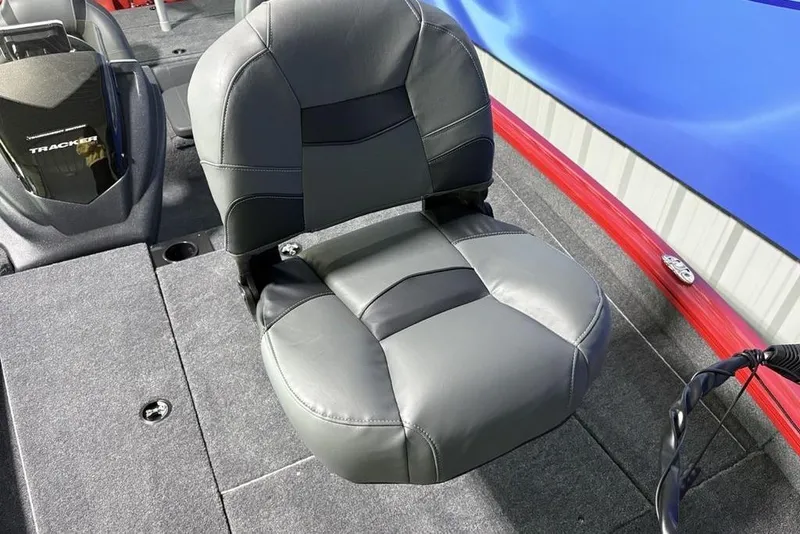 Slide: The Image of 2026 Tracker Pro Team 190 boat seat, gray upholstery, on carpeted deck. - 10