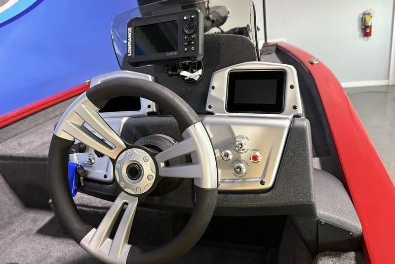 Slide: The Image of Steering console of 2026 Tracker Pro Team 190 boat with navigation controls. - 19