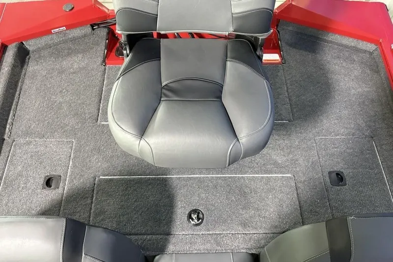 Slide: The Image of 2026 Tracker Pro Team 190 boat interior with gray seating and carpeted flooring. - 21