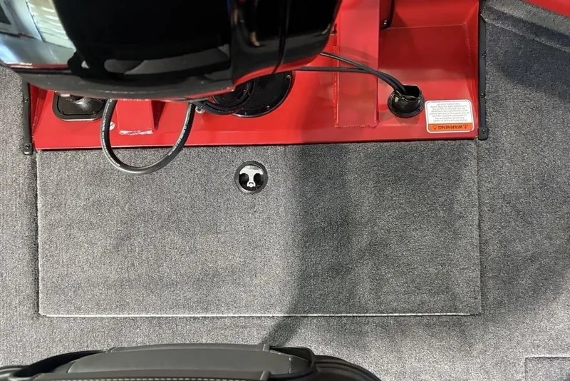 Slide: The Image of Interior view of 2026 Tracker Pro Team 190 boat, featuring red and gray components. - 22