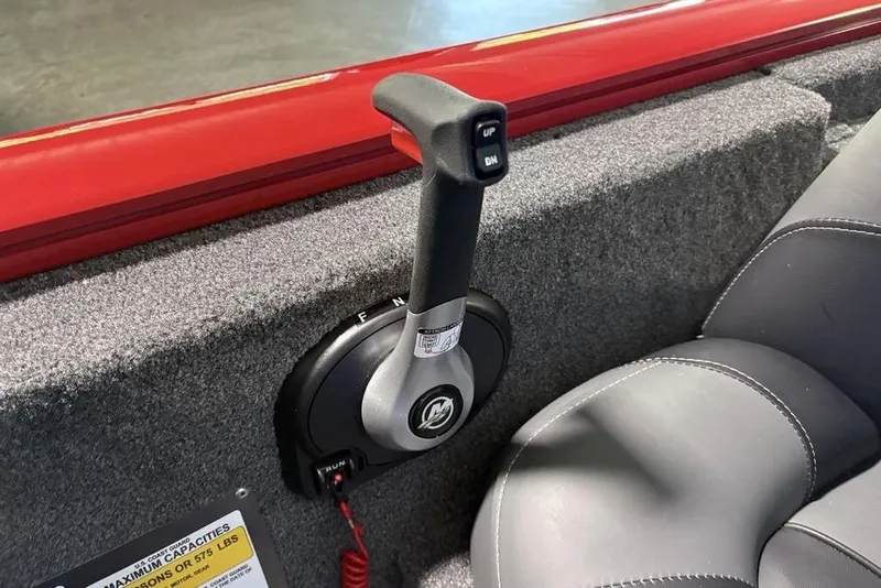 Slide: The Image of Throttle control lever in a 2026 Tracker Pro Team 190 boat interior. - 24