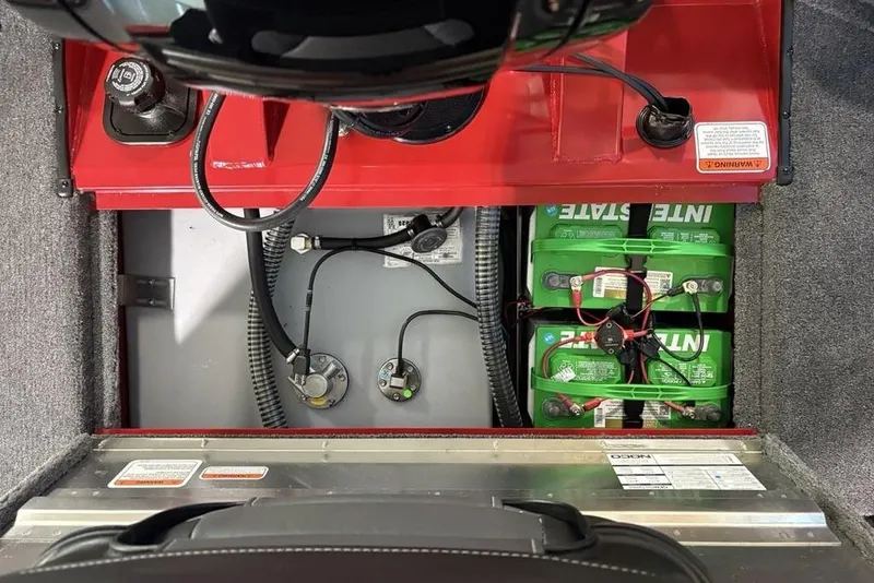 Slide: The Image of 2026 Tracker Pro Team 190 boat battery compartment with wiring and components. - 25