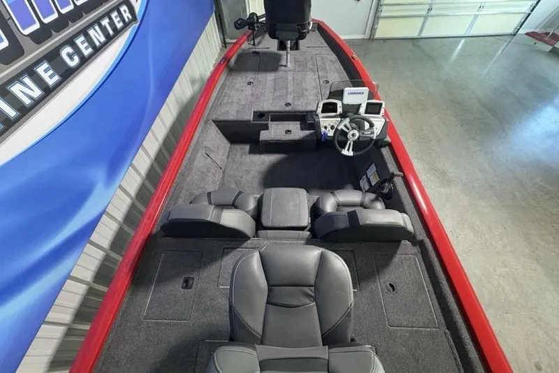 Slide: The Image of 2026 Tracker Pro Team 190 boat interior with steering console and seating. - 31