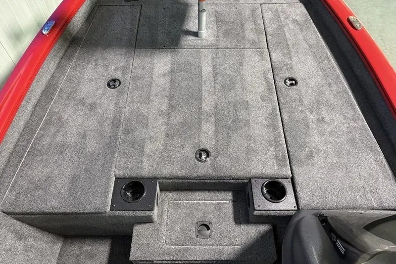 Slide: The Image of 2026 Tracker Pro Team 190 boat deck with gray carpet and red trim. - 4
