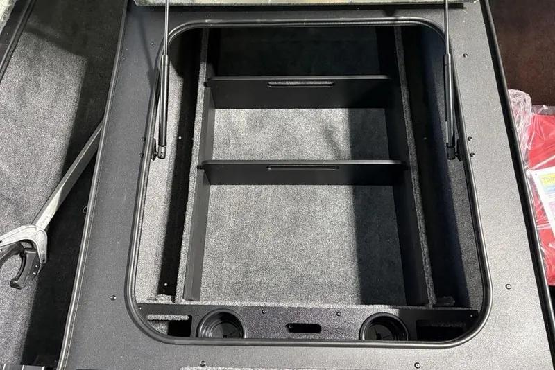Slide: The Image of 2026 Tracker Pro Team 190 storage compartment with organized interior layout. - 7