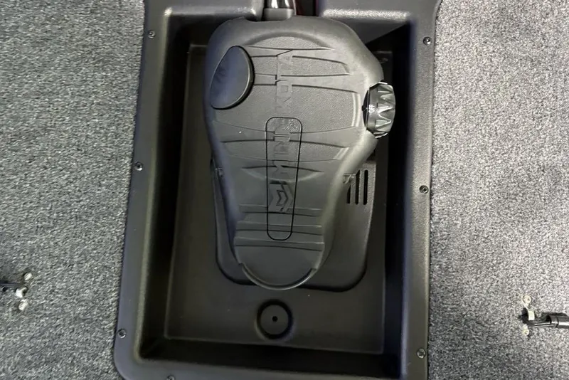 Slide: The Image of 2026 Tracker Pro Team 190 boat compartment with black plastic cover. - 9
