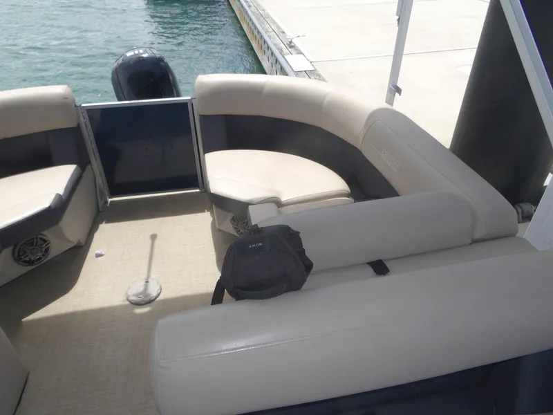 Slide: The Image of Interior of a 2024 Harris Pontoon boat at the dock. - 14