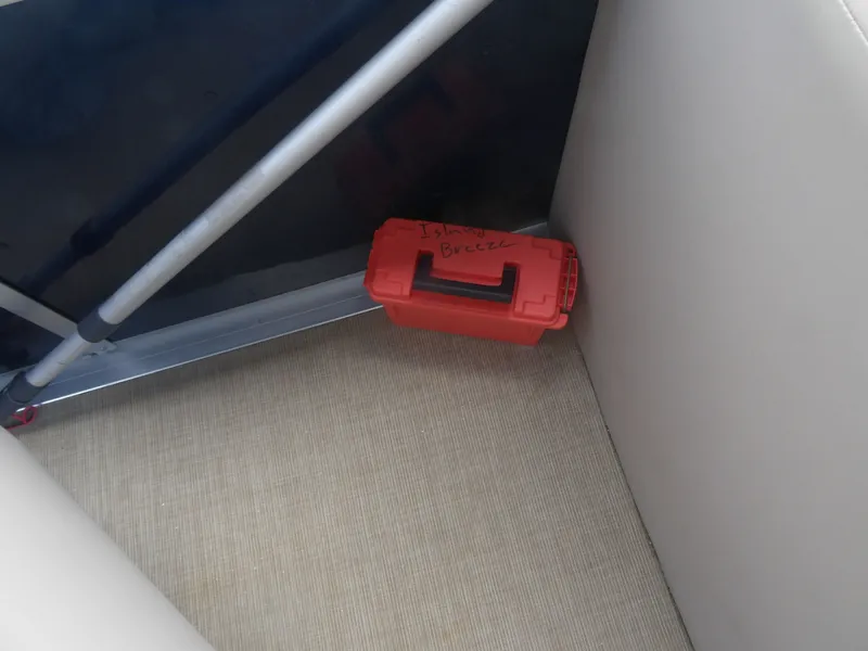 Slide: The Image of Red toolbox on 2024 Harris Pontoon boat. - 15