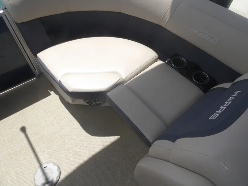 Slide: The Image of Interior of a 2024 Harris Pontoon boat with comfortable seating. - 24