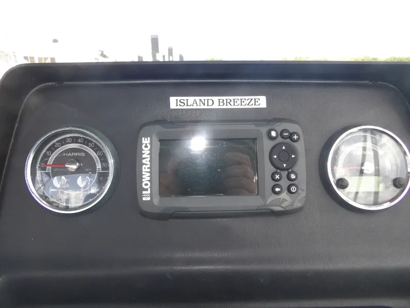 Slide: The Image of Dashboard of a 2024 Harris Pontoon with Lowrance GPS. - 29