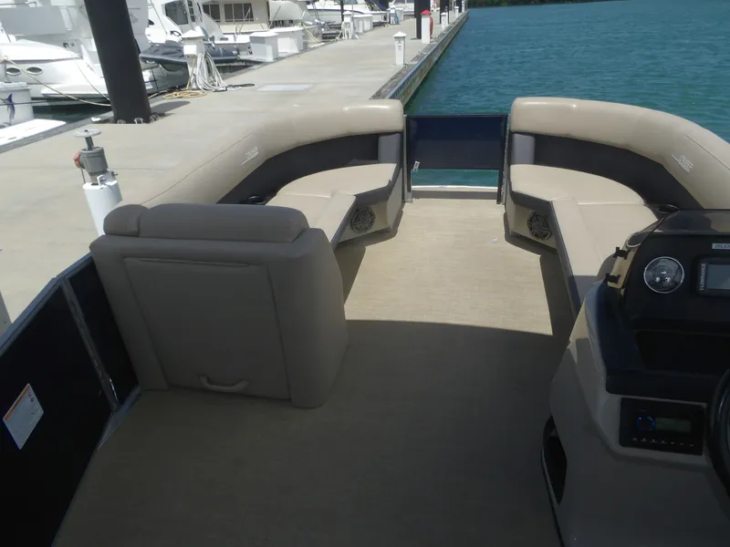 Slide: The Image of Interior of a 2024 Harris Pontoon boat at the dock. - 3