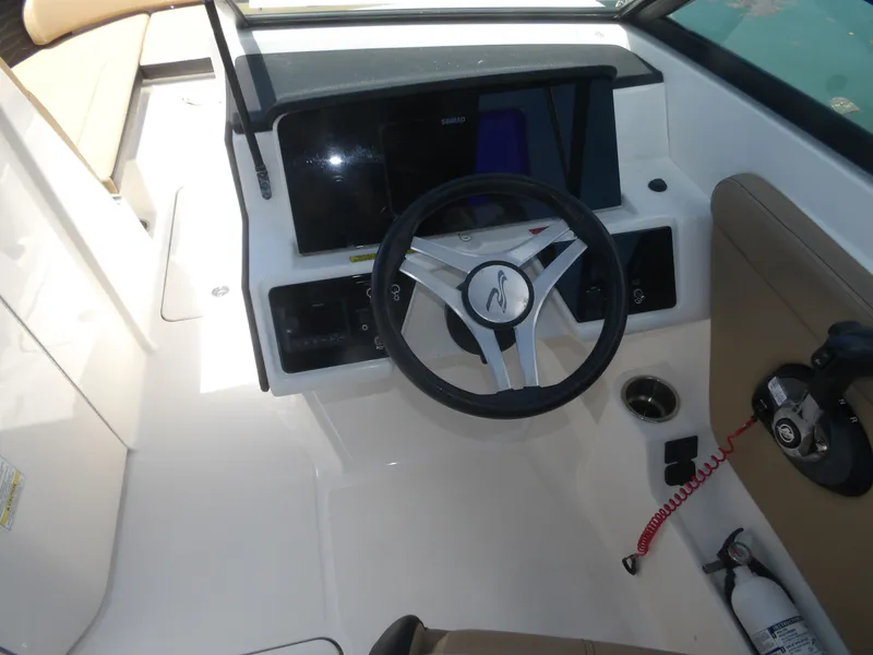Slide: The Image of Interior view of Sea Ray SPX 230 helm, model year 2024. - 10