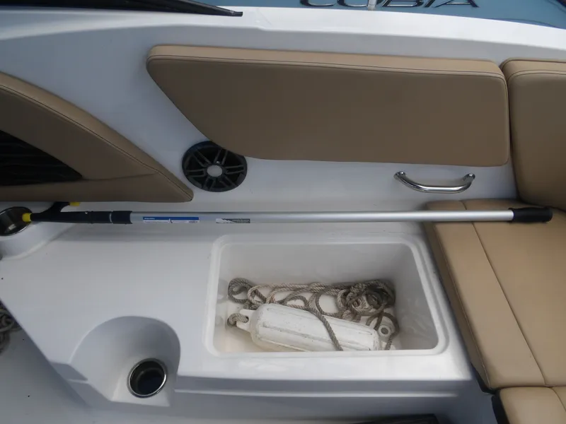 Slide: The Image of Interior of 2024 Sea Ray SPX 230 with storage and seating area. - 16